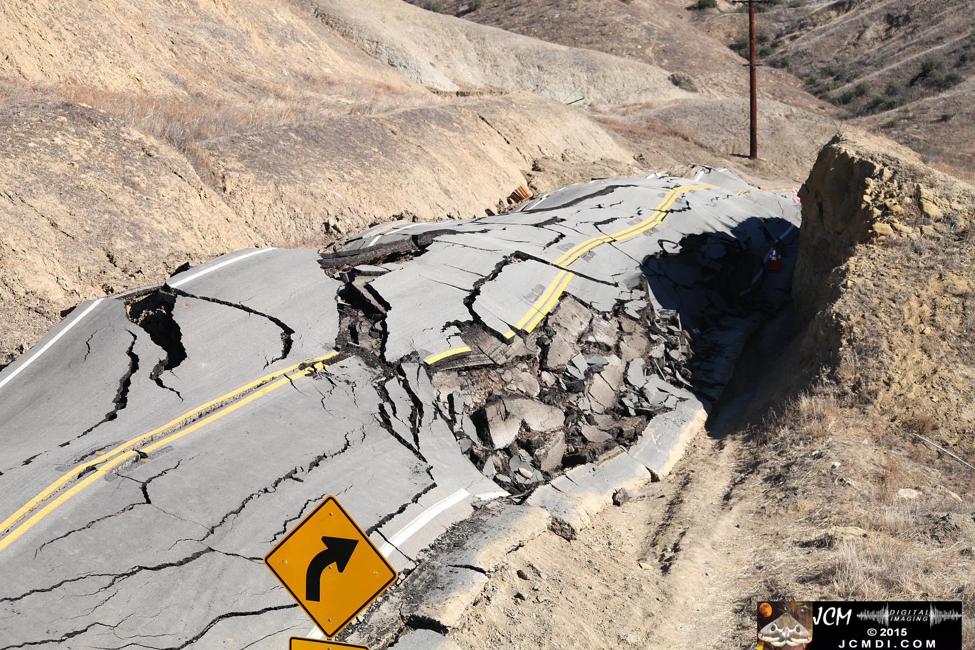 Landslide, buckled pavement, and terrain at Vasquez Canyon Road in Santa Clarita, CA filmed 11-25-2015